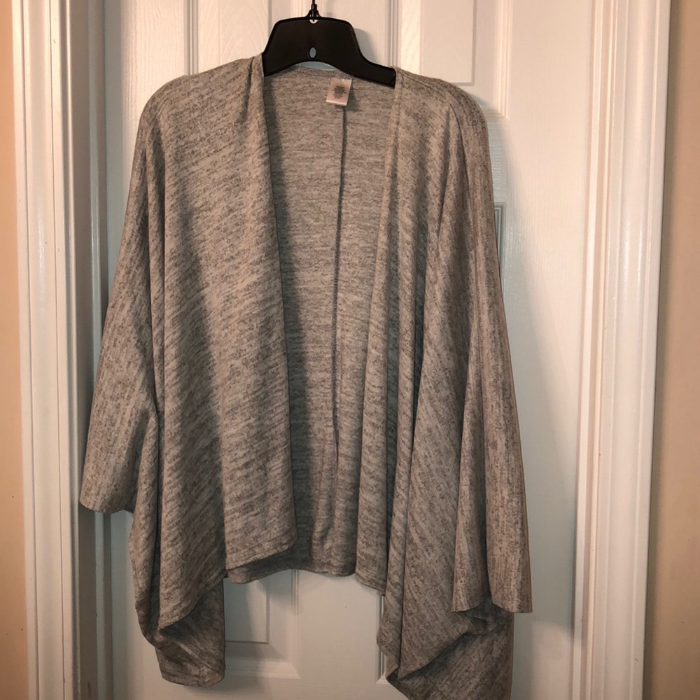 Ladies shrug/top with sleeve opening